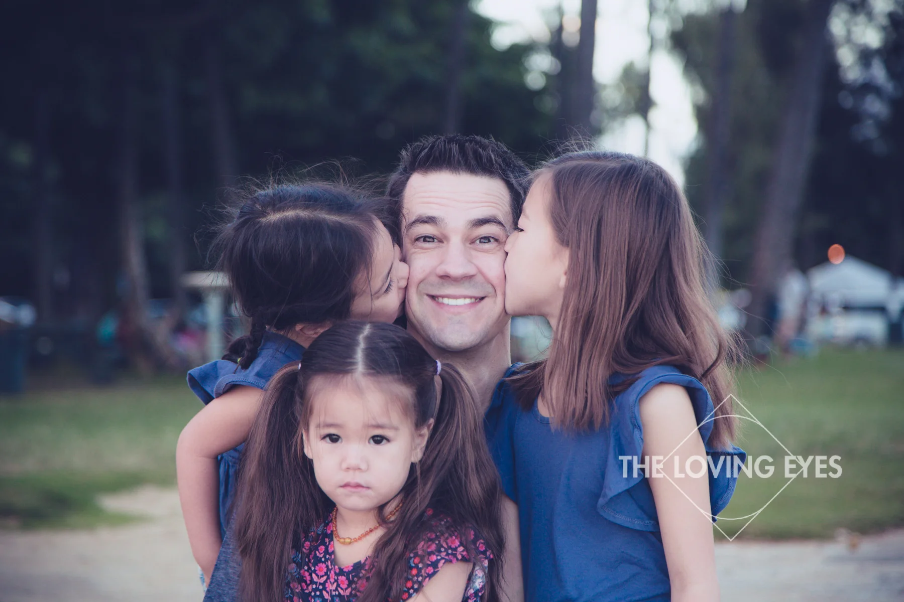 Daughter kissing dad on vacation in Hawaii