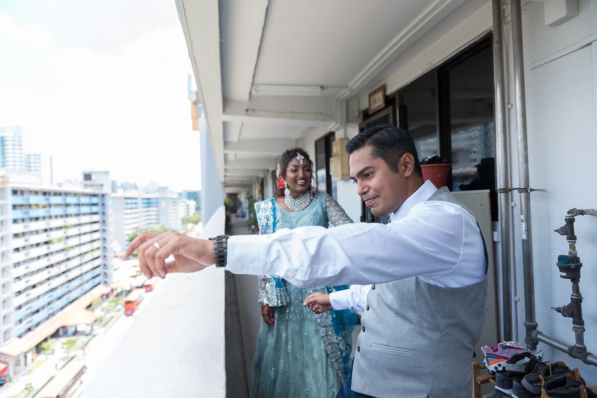 Groom dancing outside his house