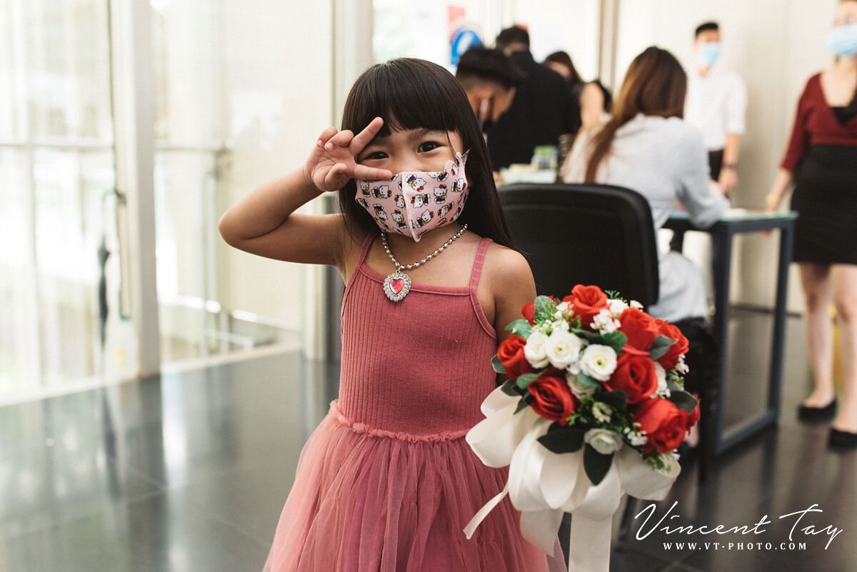 A little girl smiling at Registry of Marriage Singapore