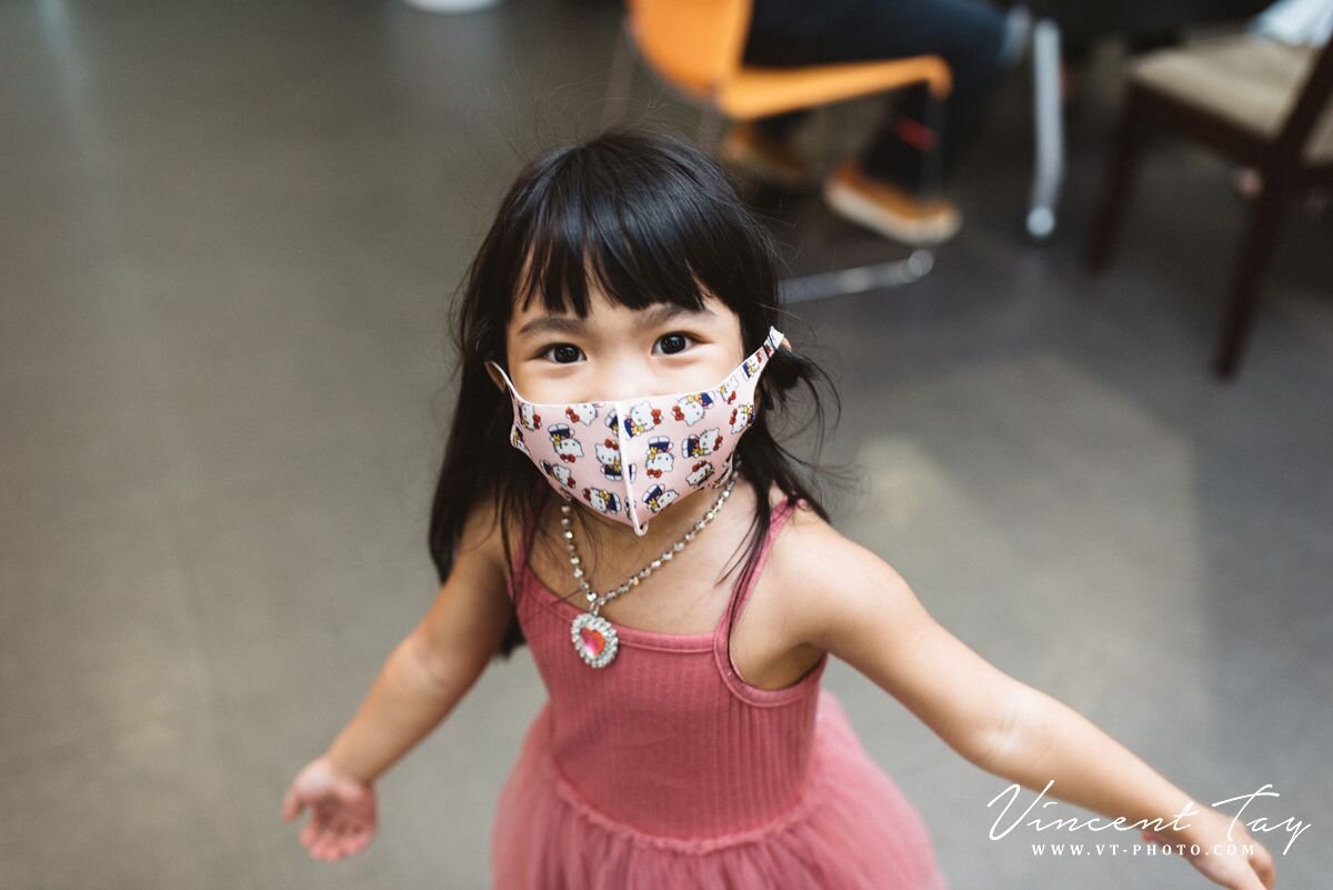 A little girl with a mask Registry of Marriage Singapore