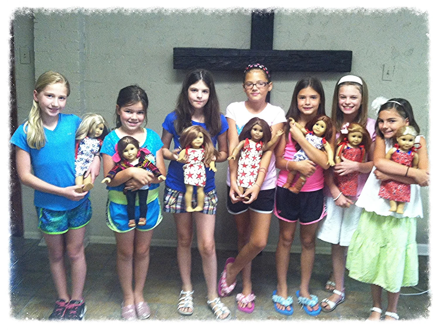 American girl dolls wearing their new dresses.