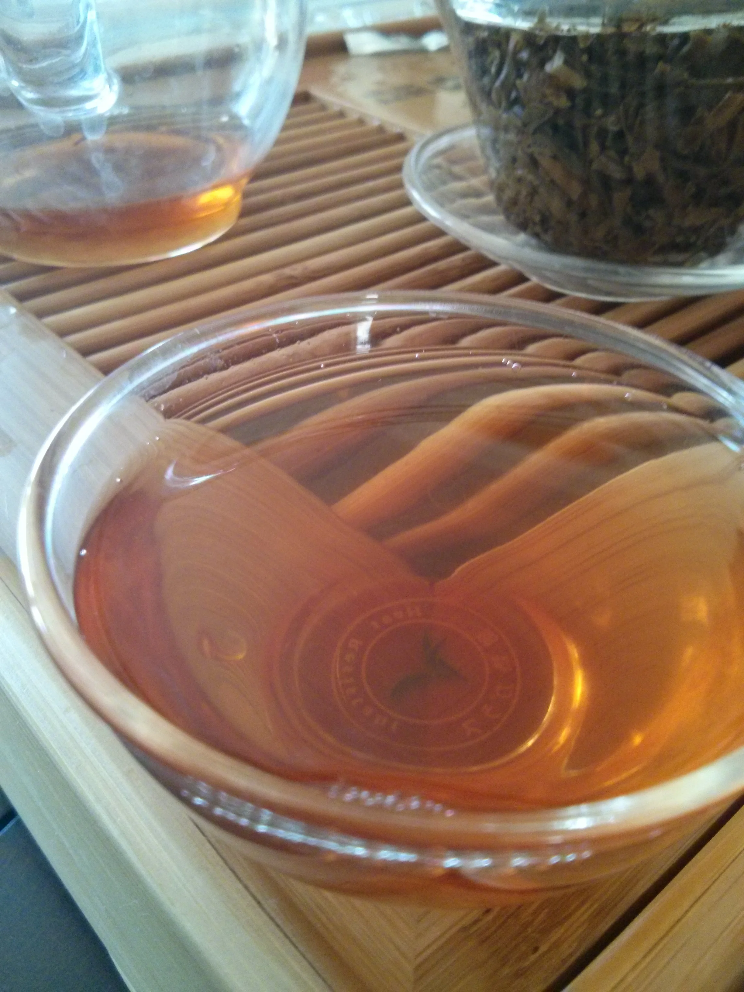 This tea's smell was lightly smokey, like roasted almonds. The taste was very strong with hints of pebbles and extremely brisk. These leaves will hold up for many, many infusions.