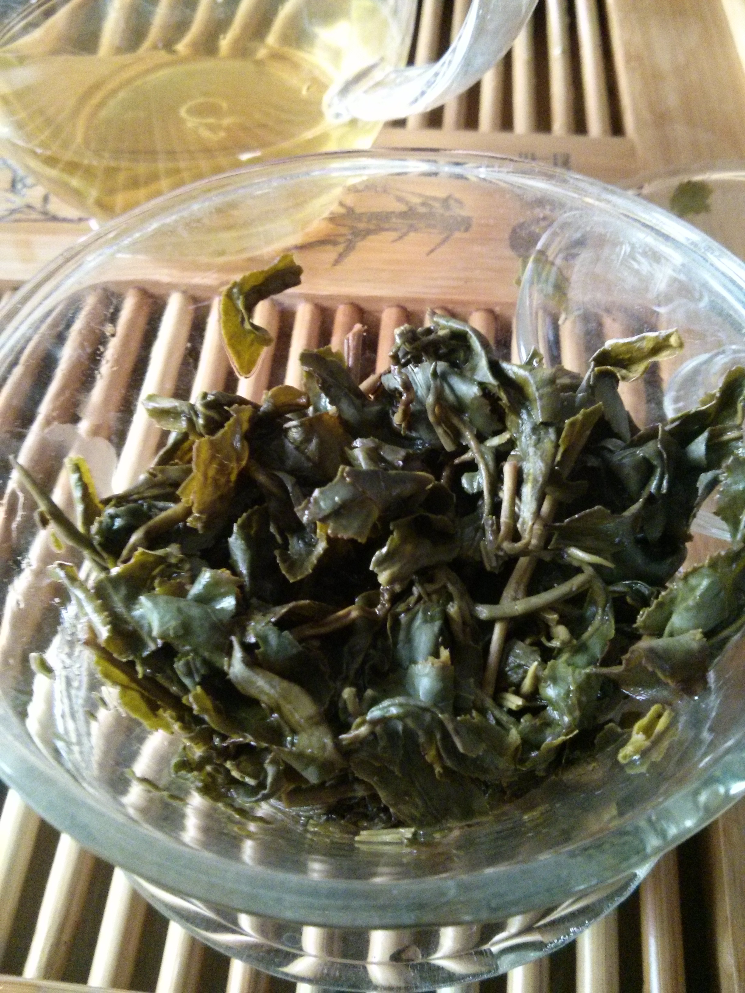 The exposed leaves. Aside from the dinky tea particles that were filtered out, the intact leaves were right on target. Eating a few, they seemed more rigid and fibrous than usual. I'm really on the fence about it the quality of this tea before tasting it (look I know it's just a sample, but come on!).