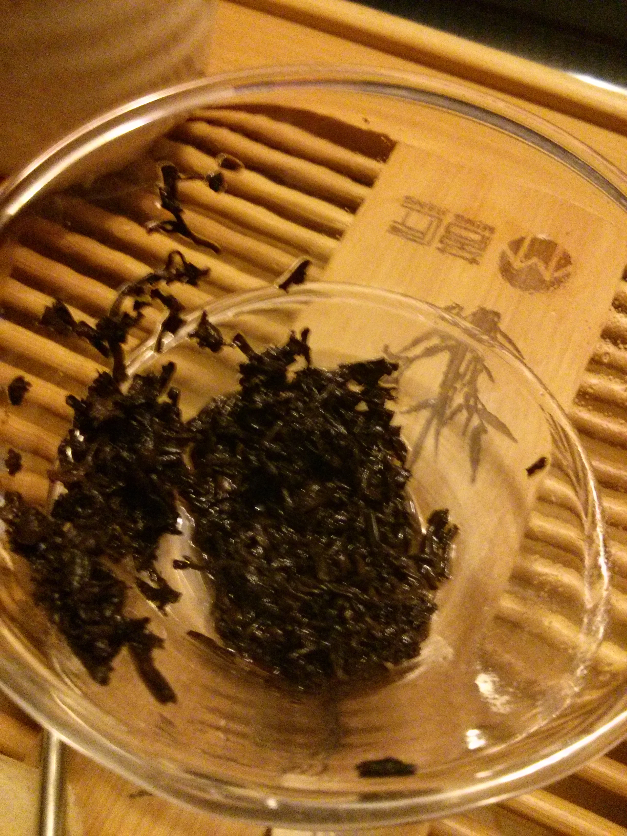 So what did it taste like? Honestly, it did taste like a typical lower-quality shu puerh. Earthy, musty, damp, astringent, bitter and warmed me to the core. I will say that maybe it was the smell of the rind, or maybe it was completely a false sense, but yes, I did get some dark, misguided citrus shining through. If you're a shu puerh fan, give it a try. It was a cheap and new experience for me.