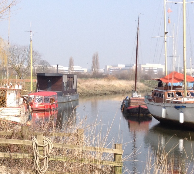 A serene site on the River Stour, Sandwich, behind are the remains from an over ambitious pharmatucial company promising the earth delivering little .