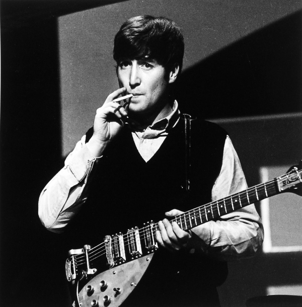 Lennon with Rickenbacker 325 and Selmer strap, 1963.