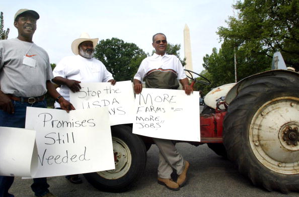 FARMERS WITH THE NATIONAL BLACK FARMERS ASSOCIATION PROTEST IN FRONT OF THE DEPARTMENT OF AGRICULTURE IN WASHINGTON, DC.