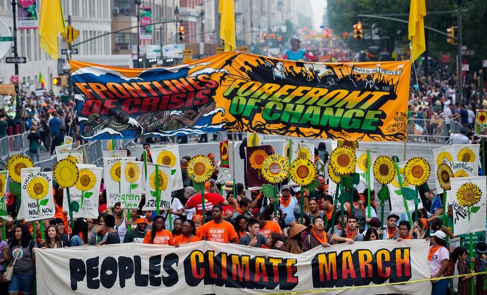 PARTICIPANTS GATHER NEAR COLUMBUS CIRCLE IN NEW YORK CITY FOR THE PEOPLE'S CLIMATE MARCH ON SUNDAY. PHOTOGRAPH BY CRAIG RUTTLE, AP