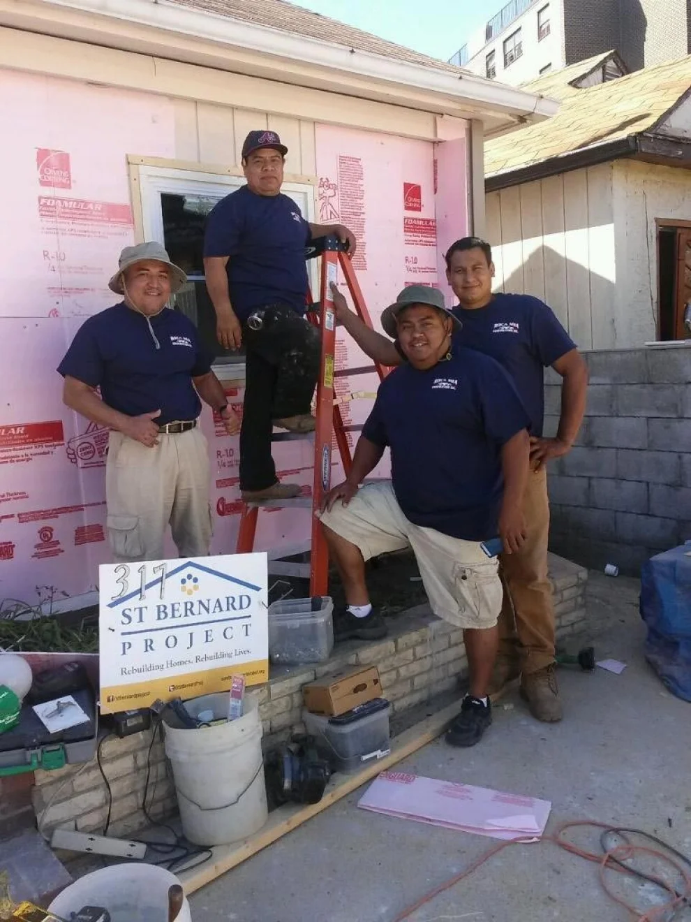 CARLOS LEZAMA, VICTOR HERNANDEZ, HENRY LEZAMA AND MANUEL ESCOBAR OF ROCA MIA CONSTRUCTION FINISHING A JOB IN FAR ROCKAWAY, QUEENS, IN JUNE OF 2014. PHOTO CREDIT: ROCA MIA