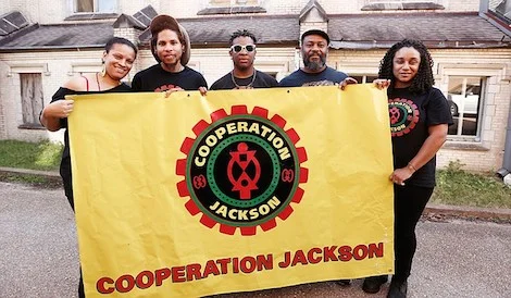 Sacajawea Hall, Brandon King, Elijah Williams, Kali Akuno and Fa’Seye Aina Gonzalez (left to right) are five members of a delegation Cooperation Jackson is sending to Paris for the upcoming COP21 Climate Conference. Photo by Imani Khayyam .