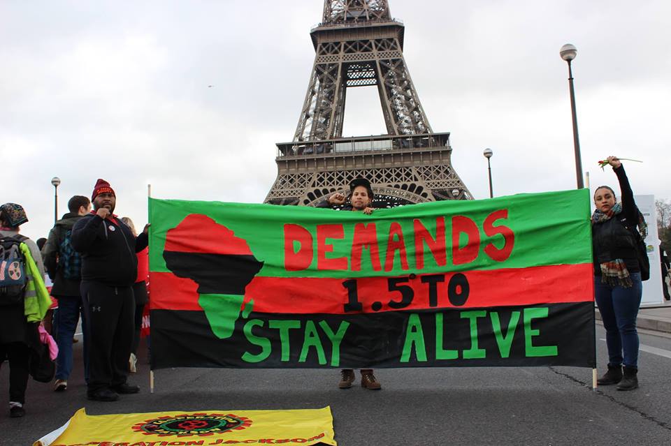 COOPERATION JACKSON MEMBERS IN PARIS AT THE REDLINES ACTION DEMANDING CLIMATE JUSTICE