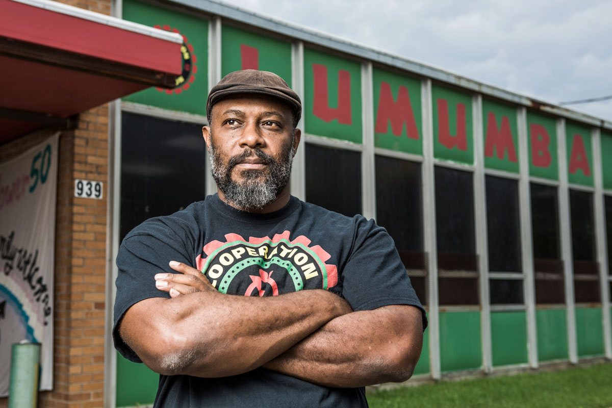 Kali Akuno in front of the Chokwe Lumumba Center for Economic Democracy and Development, where Cooperation Jackson is headquartered.