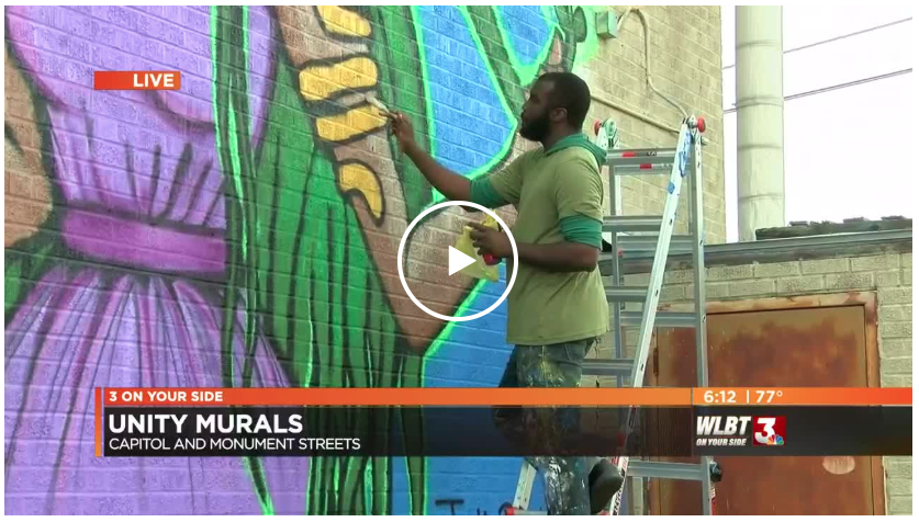 Artists create murals to beautify and unite downtown's inner city