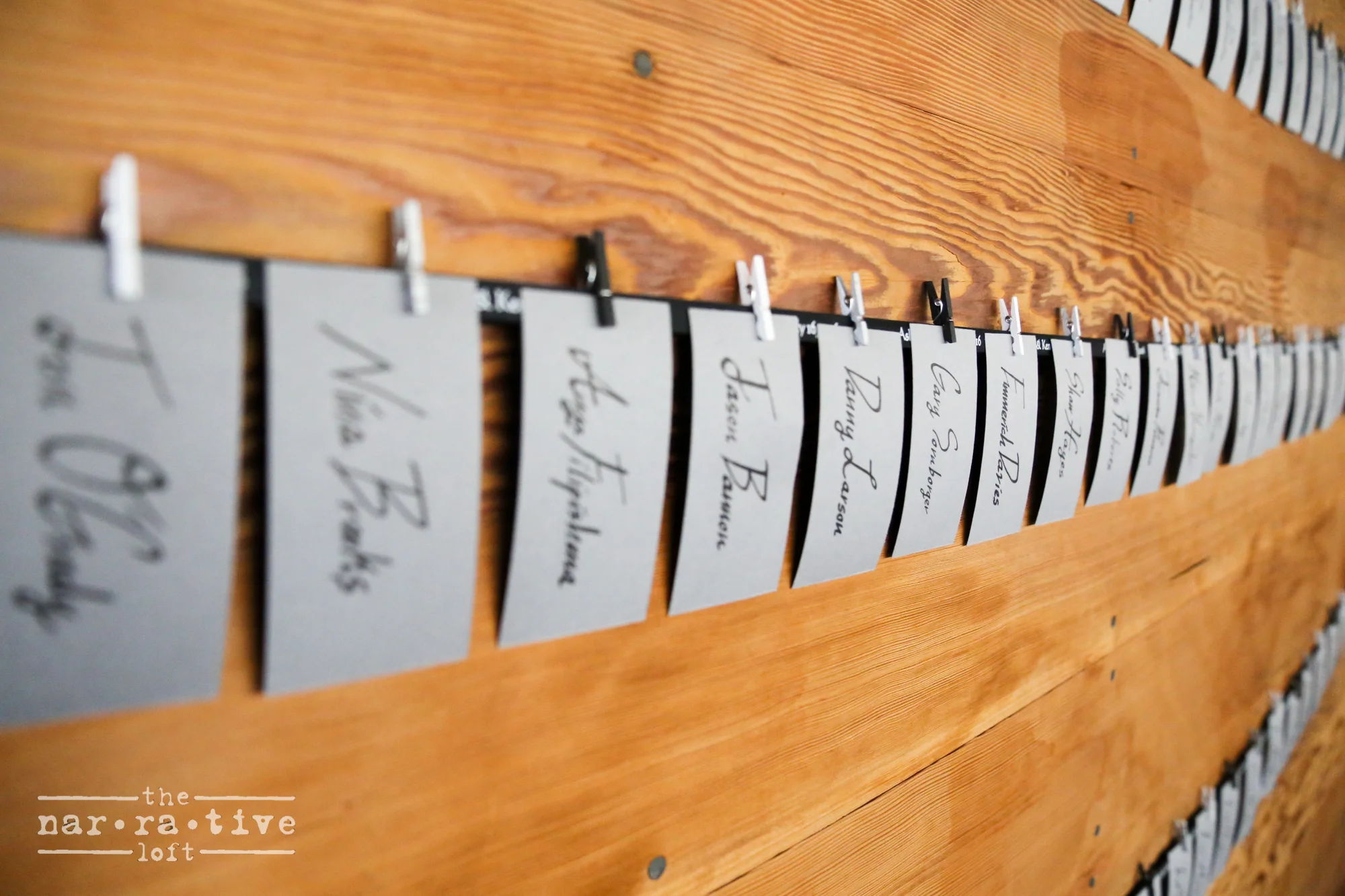 Find your seat, then switch it out with a photo from a Polaroid the couple had for guests to document their smiling faces.