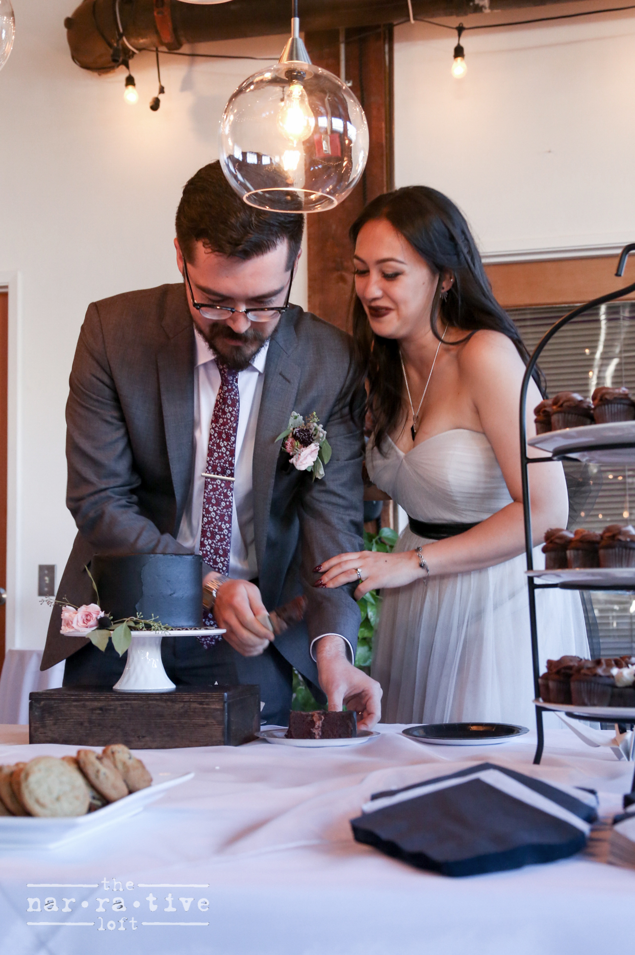 A sweet moment between Ken and Ashley cutting the cake.