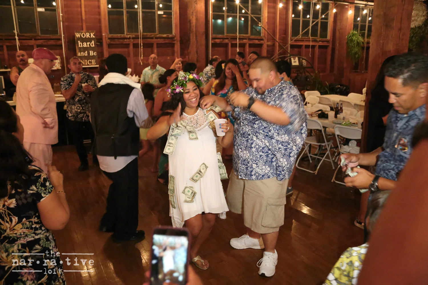 A money dance, a wedding dance where male guests place money on the brides dress to dance with her. It represents the wish of good fortune and financial prosperity for the newlyweds.