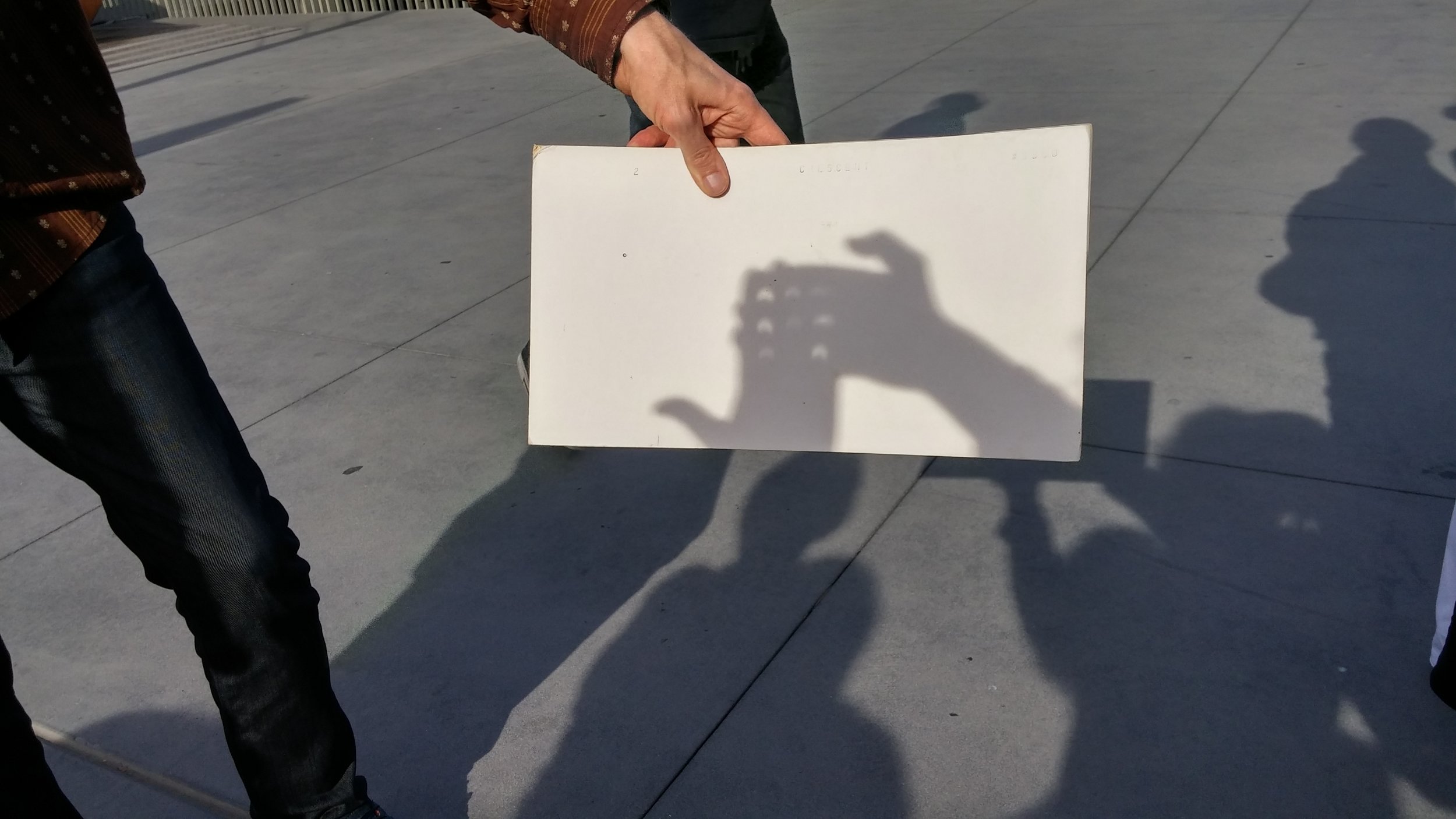 Having fun with colleagues. Making crescent suns.