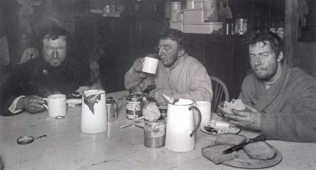 Wilson, Bowers and Cherry-Garrard tuck into a well-earned meal back at Cape Evans, having endured some of the worst conditions on Earth in the name of science.
