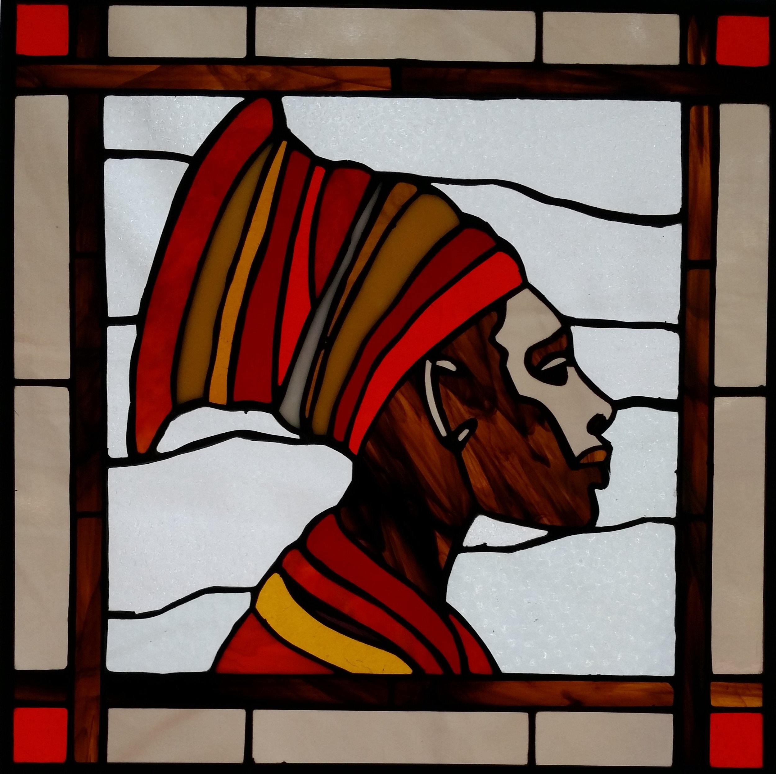 stained glass image of woman in headwrap by Arvid Lee