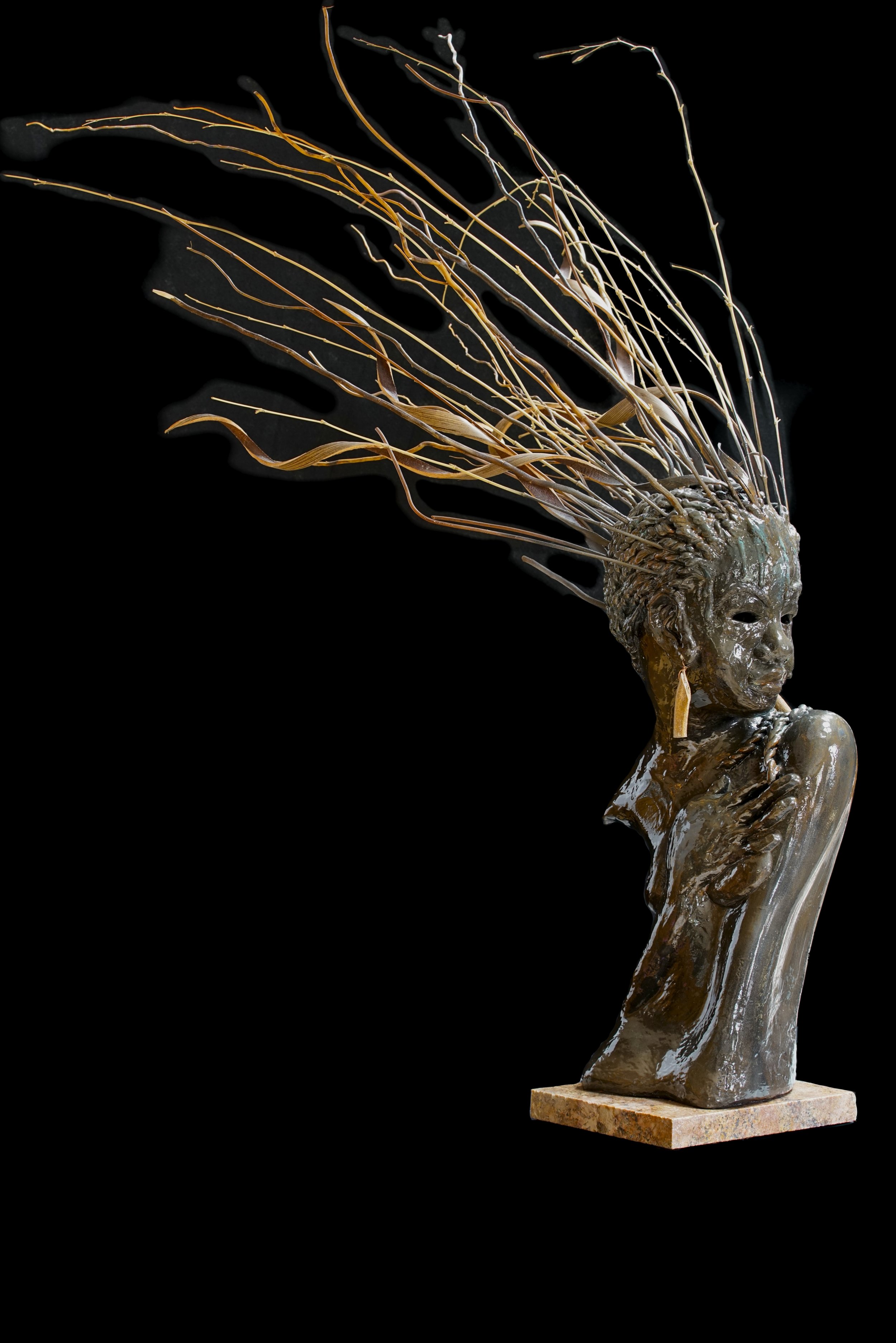 sculpture of bust of woman with flowing hair by Aaron Paskins