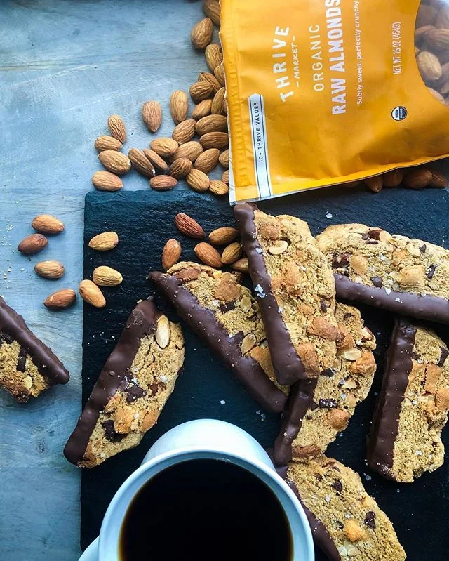 We’re getting to that time where pesach is taking up most of our brain and the time has come to buy lots and lots of nuts. I’ve teamed up with @thrivemarket to bring you these epic almond chocolate chunk biscottis that are gluten free and kosher for P!
Thrive market has a bunch of items that are approved by the @oukosher for Passover without special certification like nuts, baking soda and olive oil. They are organic, with great prices and delivered to your door!
For those of you who have been patiently waiting for this recipe, bless you! And here it is!!! These are actually so good that my mother in law has hidden the couple I brought to taste in the freezer so the rest of the family doesn’t steal it 🙈
Oops! Sorry for revealing the spot!
Feel free to replace the fillings (chocolate, almonds, and marzipan) with your favorite fillings!
3.5 c gluten free Flour blend (see previous post)
1/2 c Sugar
1 tsp @thrivemarket Baking soda
1/4 c @thrivemarket olive oil
1 tsp Cinnamon
Pinch Salt
1/2 c @thrivemarket Almonds chopped
2 Eggs
1 tsp Vanilla
1/2 tsp Almond extract
1 cup chocolate chunks
1/2 c Marzipan, diced and tossed with 2 tbsp flour blend (optional)
I used @busyinbrooklyn recipe
1 cup chocolate, melted (optional)
Preheat oven to 350F
Mix the flour, sugar, baking soda, cinnamon and salt together in a large bowl
In another bowl mix the extracts, oil, and eggs. Pour into the dry ingredients and mix until just combined
Fold in the chocolate, almonds, and marzipan if using.
Shape into 2 7x3 loaves with wet hands and place on a baking sheet lined with parchment. Bake for 25 minutes until golden.
Allow to cool completely (legit so it doesn’t crumble!) before slicing diagonally and baking cut side up in a single layer at 300F for 20 minutes or until crisp but not burnt.
Dip into melted chocolate if desired
Eat lots!
#sponsored, #ThinkingThrive #glutenfree #dessert #passover #passoverrecipes