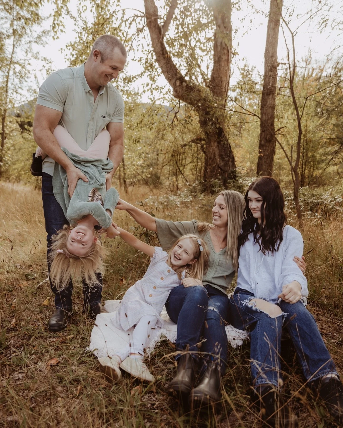 The first time I captured this sweet family at this very location, one little lady was missing. I remember editing their photos and noticing a hand gently placed over mama’s stomach, and I thought to myself, “I wonder if she’s pregn