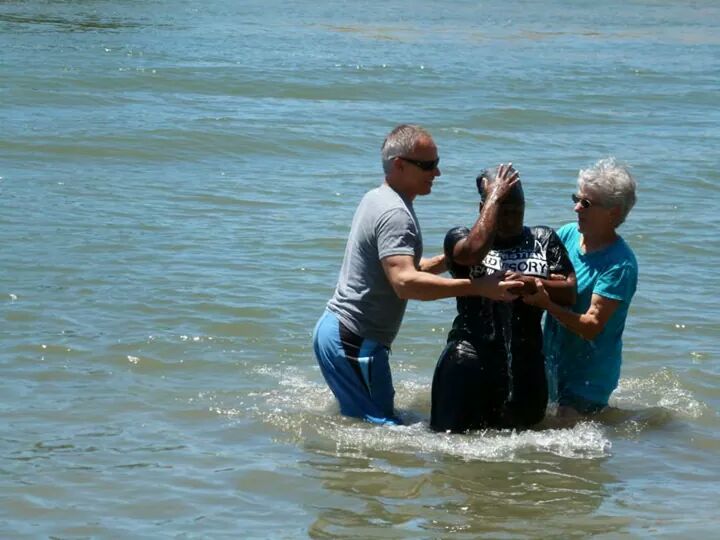 Brown Theory, rising up from her baptism. 
