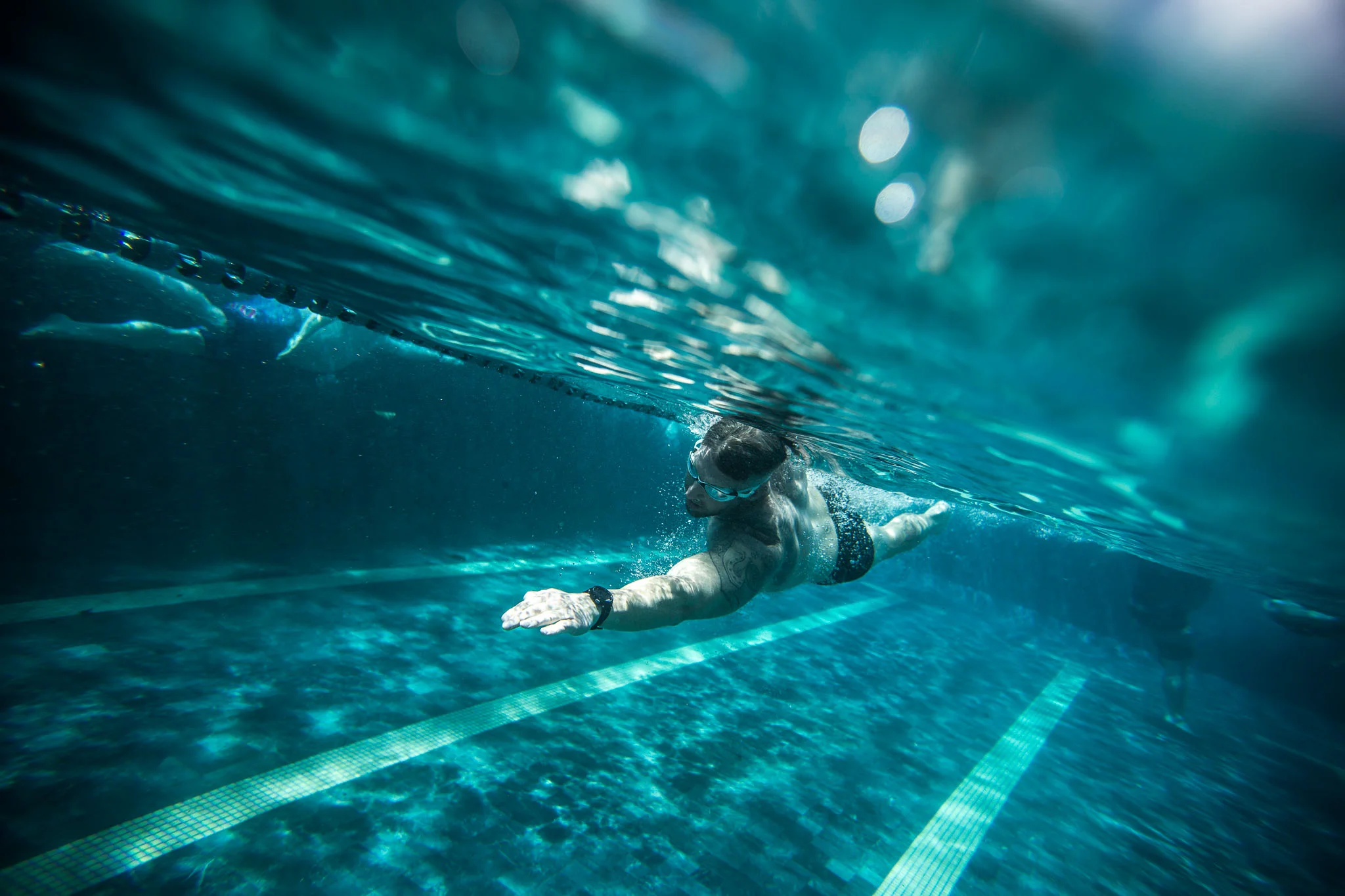 Swimmer training in a pool in California during a triathlon trai