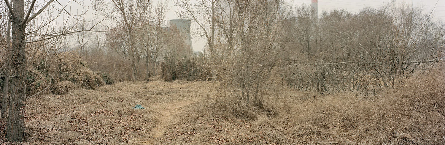 Farmer’s Backyard. Lanzhou, Gansu, China. 2011 The incongruity of a coal-fired power station located next to farmland is a common sight in China. Land is the only asset farmers have and is typically their only source of economic stability. However, Chinese farmers do not have property rights and the government is able to reallocate land, often to big businesses that will drive the economy or those with better political connections. The state is supposed to pay farmers fair compensation, but often the price they set is far below market value. Environmental laws exist but they are often not enforced.