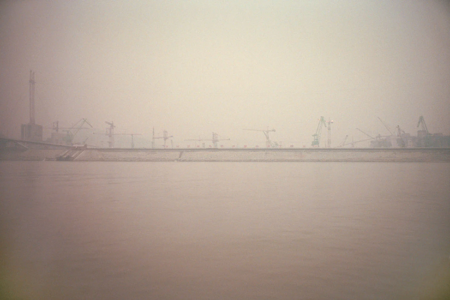 A view of the Three Gorges Dam under construction seen from the Yangtze River. Sandouping, China.
