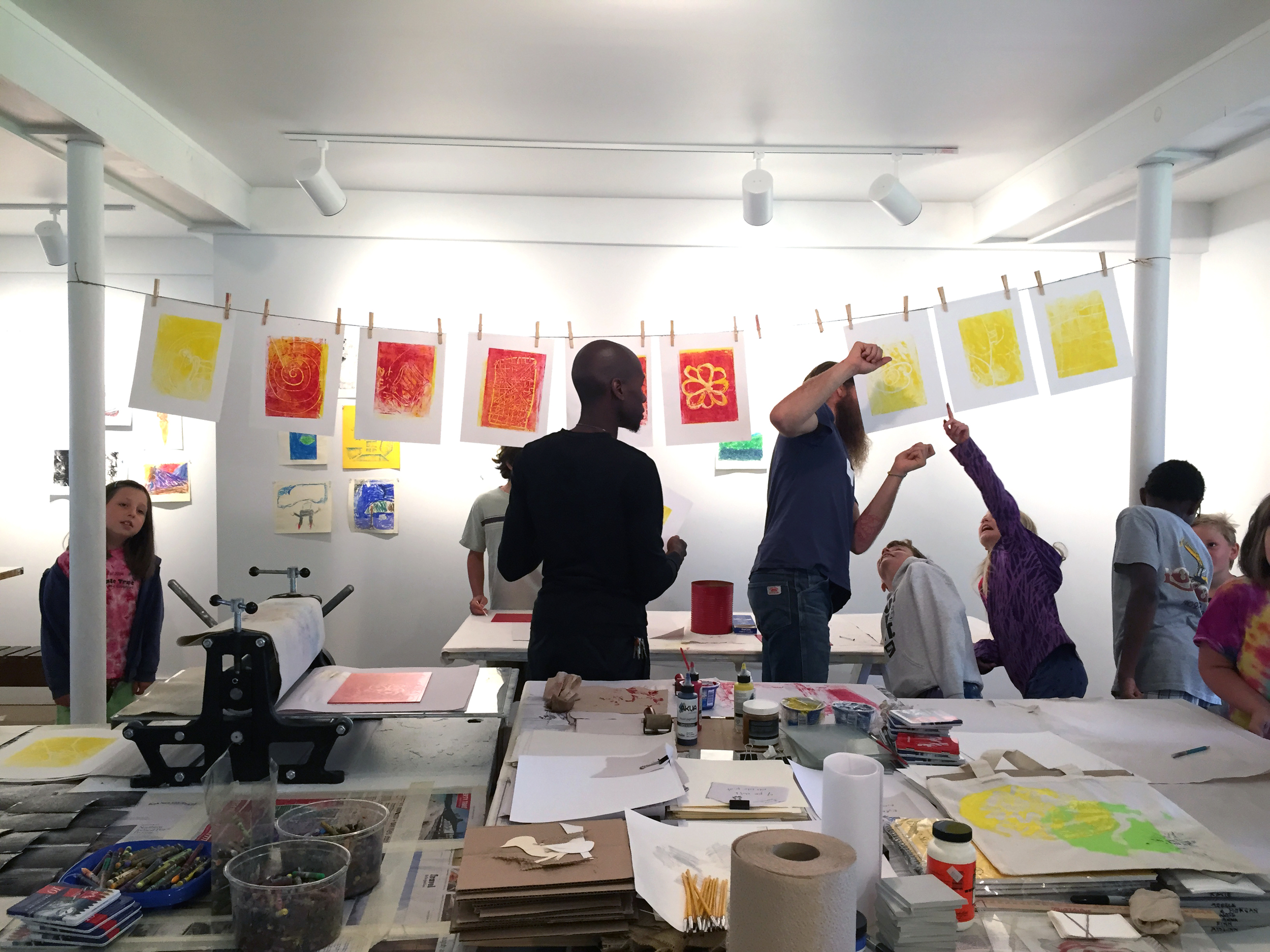 Chukwuma and Sean running the primary color printing process