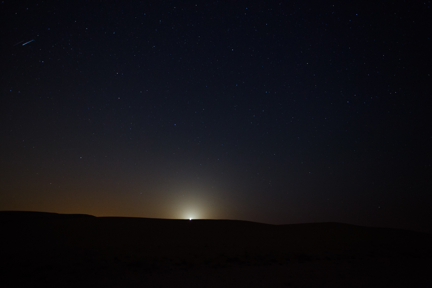 The only shot I have of a meteor which happened to whizz by as I was capturing the rising moon.