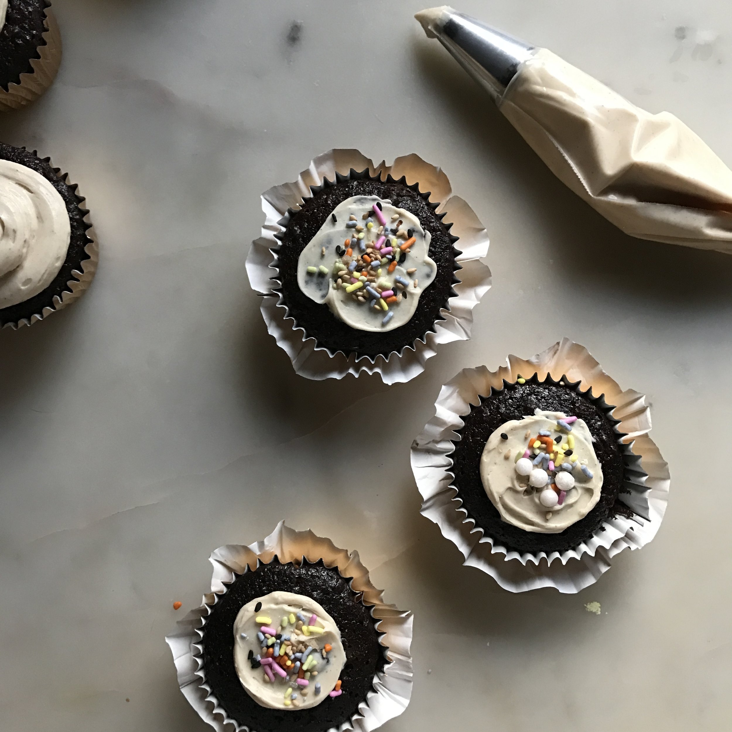 This was a blooper that turned into something beautiful. I didn't adequately separate the cupcake liners so a few were doubled up, I gently pulled them apart and made flowers. Wasteful? Perhaps. Lovely? Indeed.