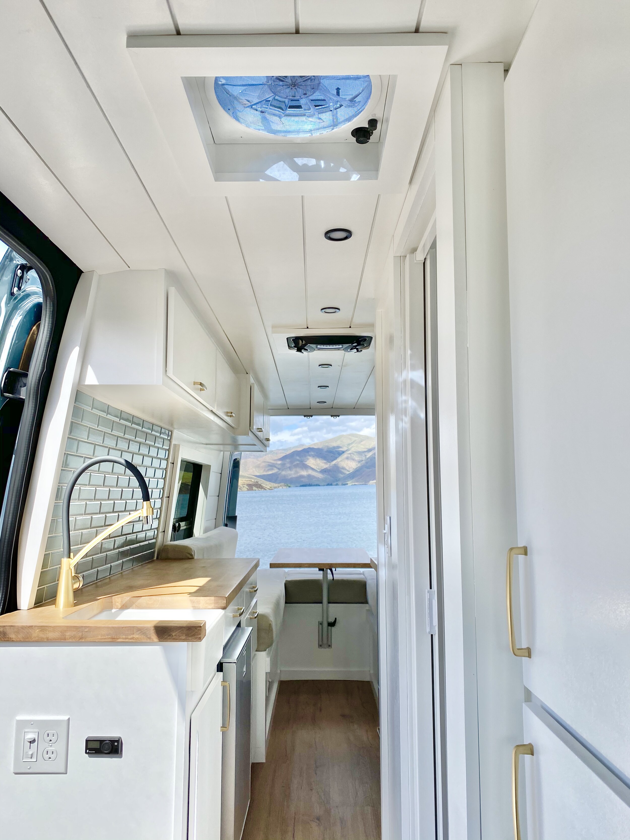 VAN TOUR 170" Extended 4x4 3500 Mercedes Sprinter Van Conversion with Bathroom — Sara & Alex