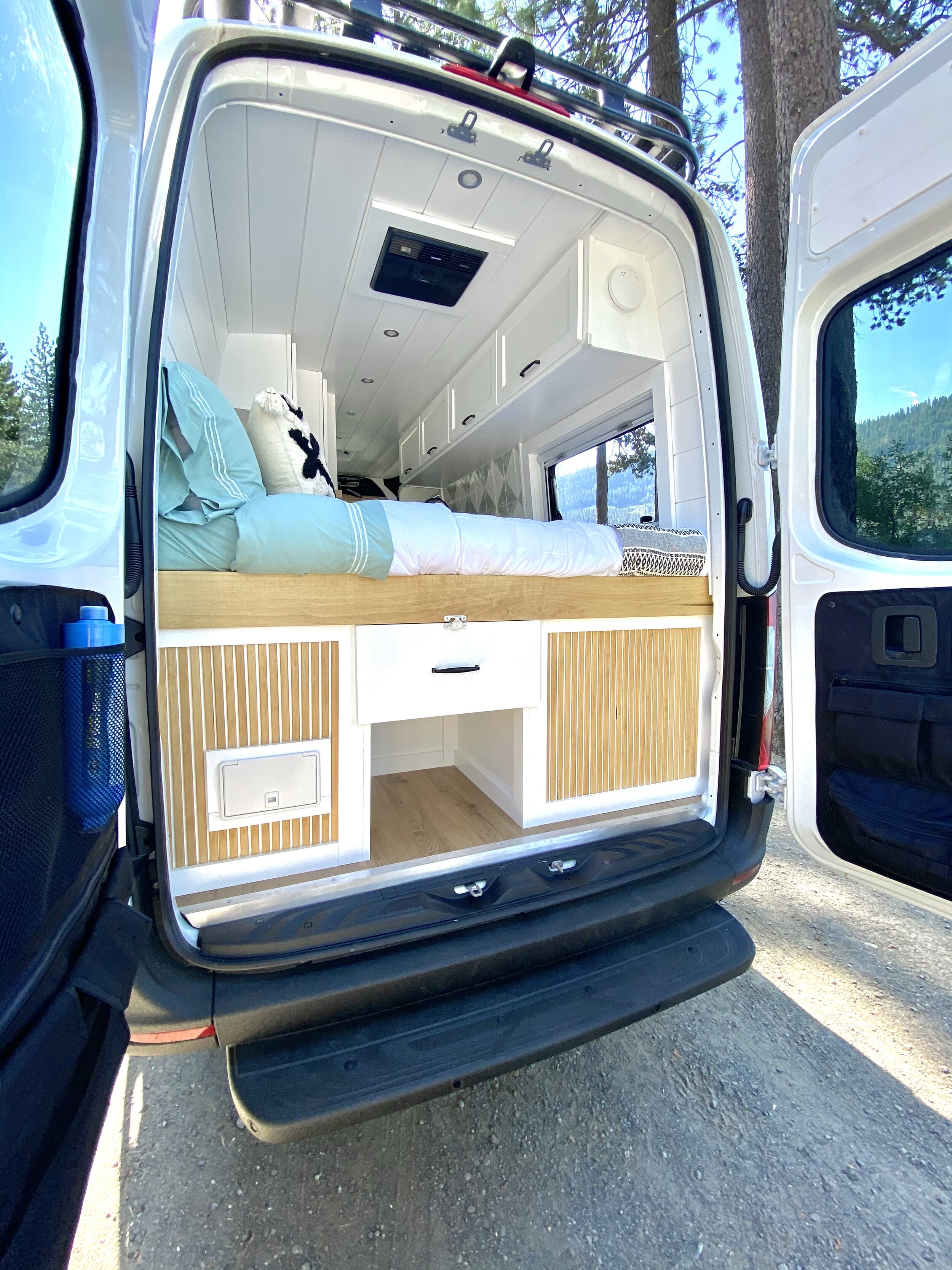 Custom Crafted Luxury Van Conversion for Family of 3 main bed.jpg