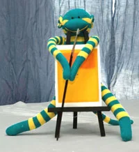 Pascal is the only monkey who can calm those triplets down because he is a brilliant portrait painter...