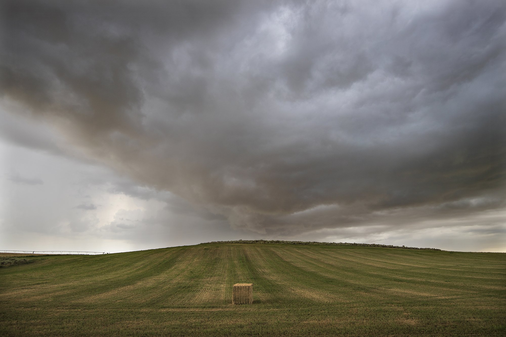 Hay bale and storm approach