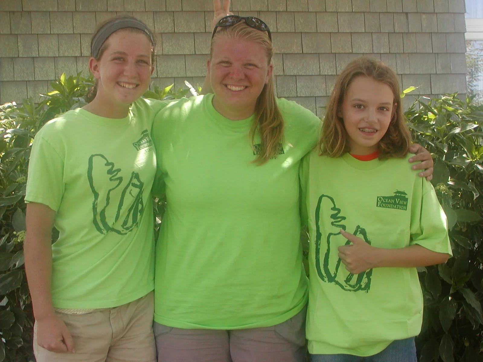 Summer Field Workers: Going left to right, Erica, Meg and Lucy posing outside of the library.