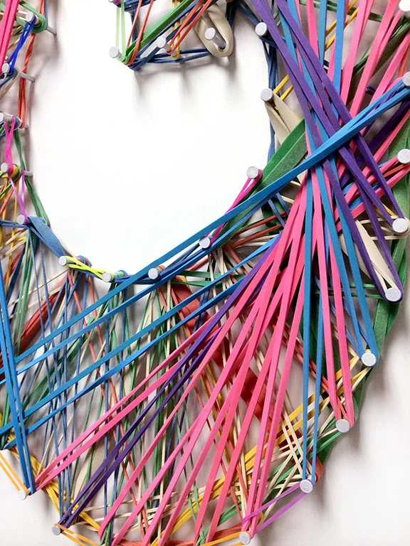   Made with nails and colorful rubber bands.  