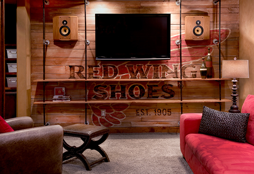   Game Room—Pipe shelving with hand-painted&nbsp;wood wall.  
