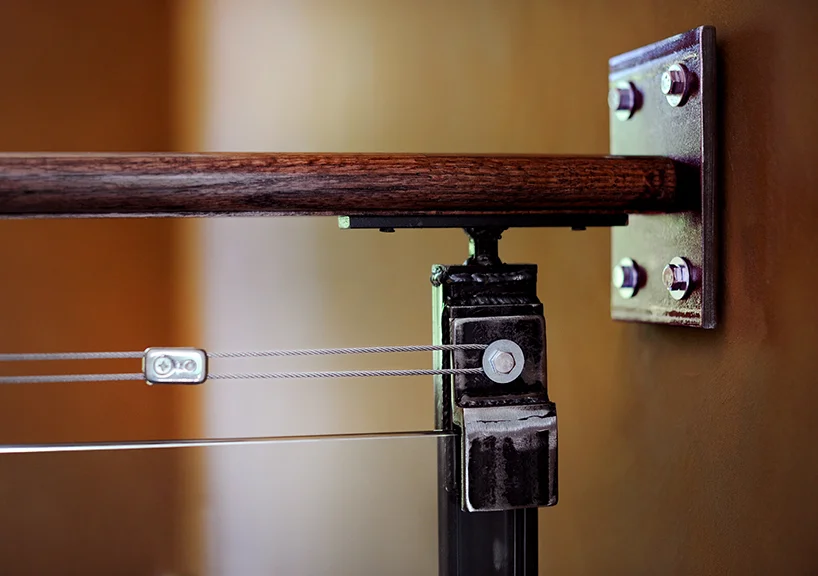   Stair Rails—made with forged steel, wood and glass.  