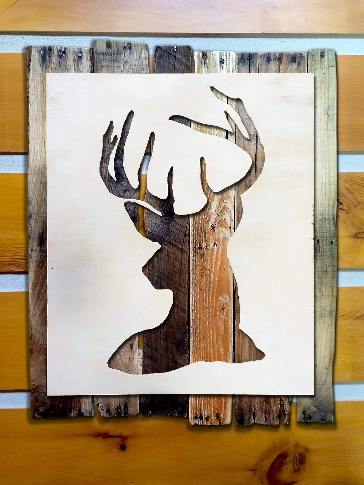  Hand-cut silhouette mounted on reclaimed wood. 
