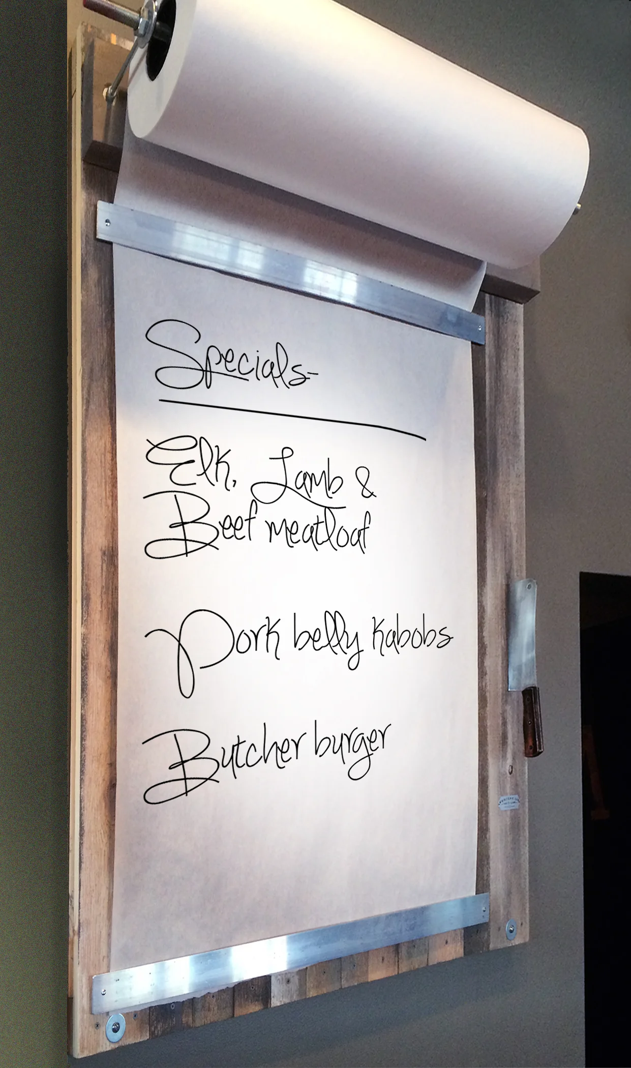  Custom butcher paper display for daily specials. 