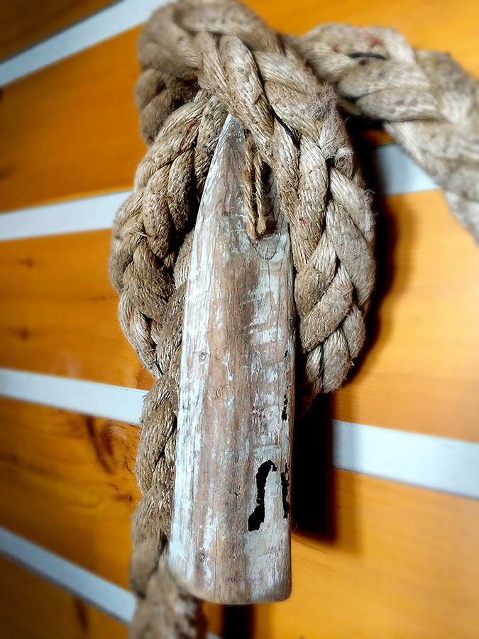  Rope mirror detail of old, weathered&nbsp;wood buoy. 