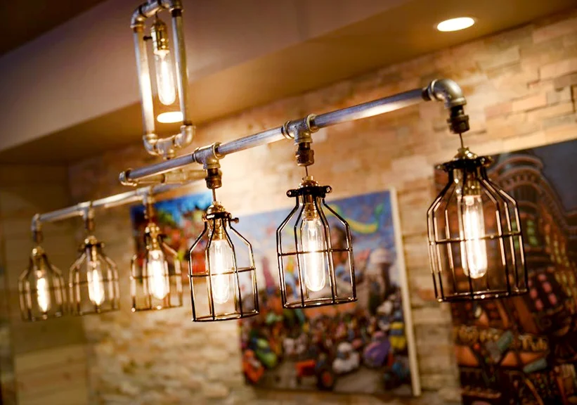   Chandelier—made from galvanized pipes &amp; refrigerator bulbs.  