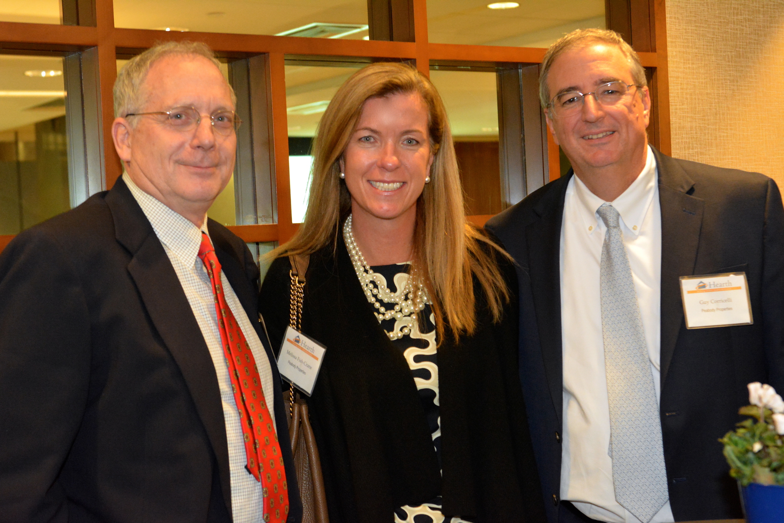  Hearth Board Member Bob Bickford (left) with Melissa Fish-Crane and Guy Corricelli of Peabody Properties.&nbsp; 