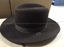 Sixty-six (66) Stratton Hats- Style: Sherriff; Material: Felt 3X; Color: Brown; Sixty (60) are new in box and six (6) are new without box. There are two (2) each of all the following sizes except where noted otherwise: 6 1/2 regular, 6 1/2 wide oval, 6 1/2 long oval, 6 5/8 regular, 6 5/8 wide oval, 6 5/8 long oval, 6 3/4 regular, 6 3/4 wide oval, 6 3/4 long oval, 6 7/8 regular (one each), 6 7/8 long oval, 7 regular, 7 wide oval, 7 long oval, 7 1/8 wide oval, 7 1/4 regular, 7 1/4 wide oval, 7 1/4 long oval, 7 1/4 extra long oval, 7 3/8 regular, 7 3/8 wide oval, 7 3/8 long oval, 7 1/2 regular, 7 1/2 wide oval, 7 1/2 long oval, 7 5/8 regular, 7 5/8 long oval (one each), 7 3/4 regular, 7 3/4 wide oval, 7 3/4 long oval, 7 7/8 regular, 7 7/8 wide oval, 7 7/8 long oval, 8 1/8 regular