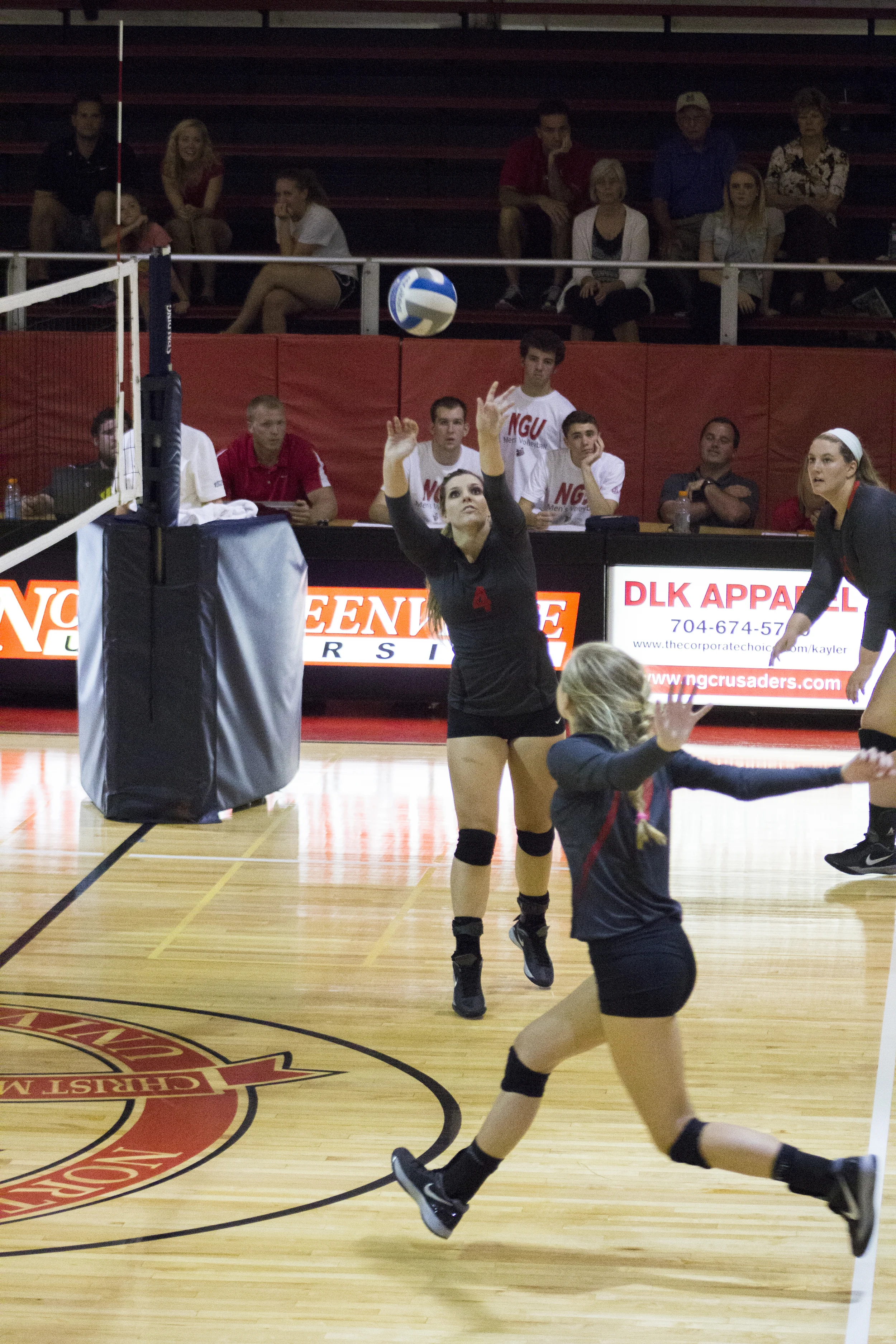 Sophomore Ashlyn Wilkinson sets for Haley Hester.