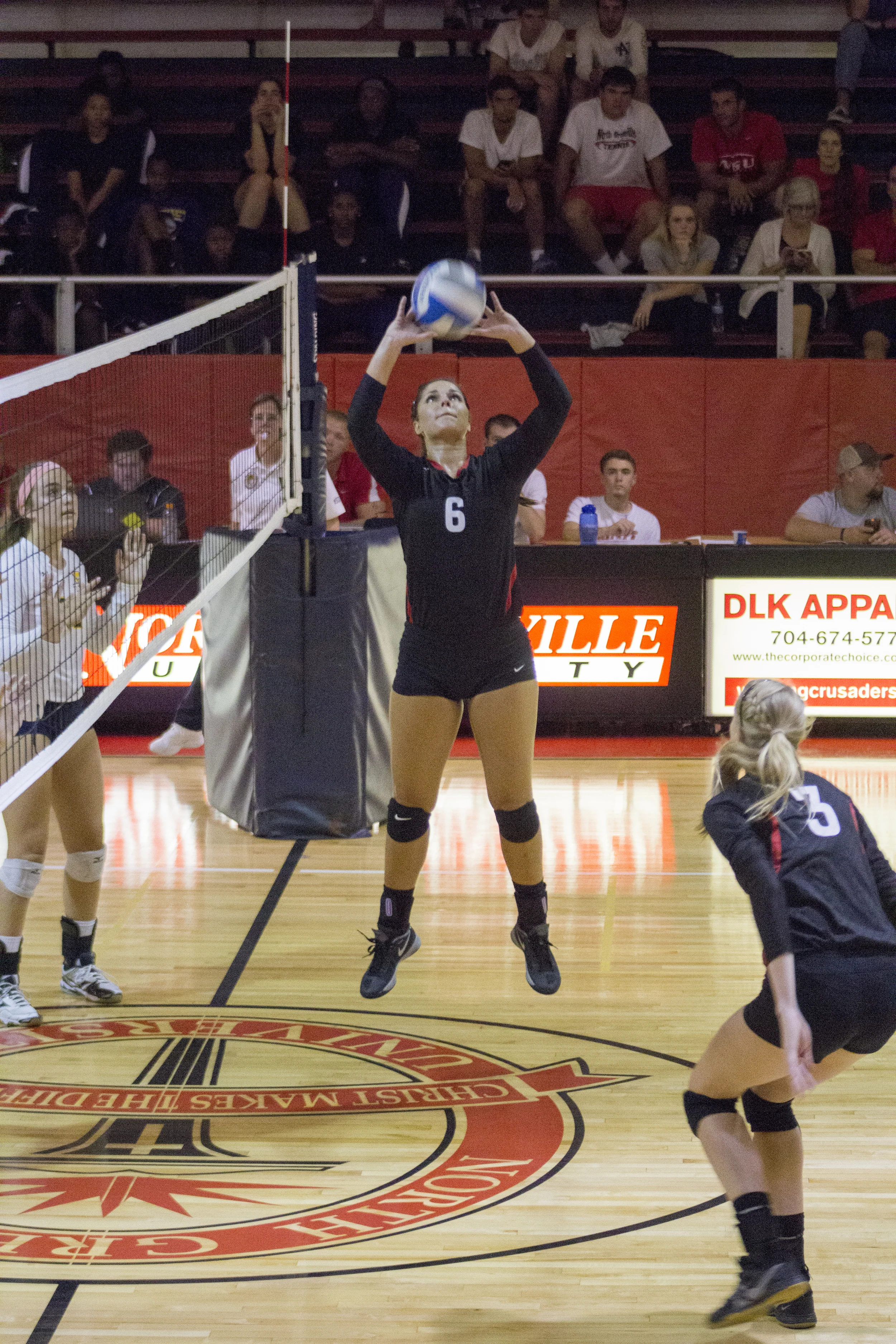 Senior Elizabeth James sets the ball up for sophomore Rachel Burts. 