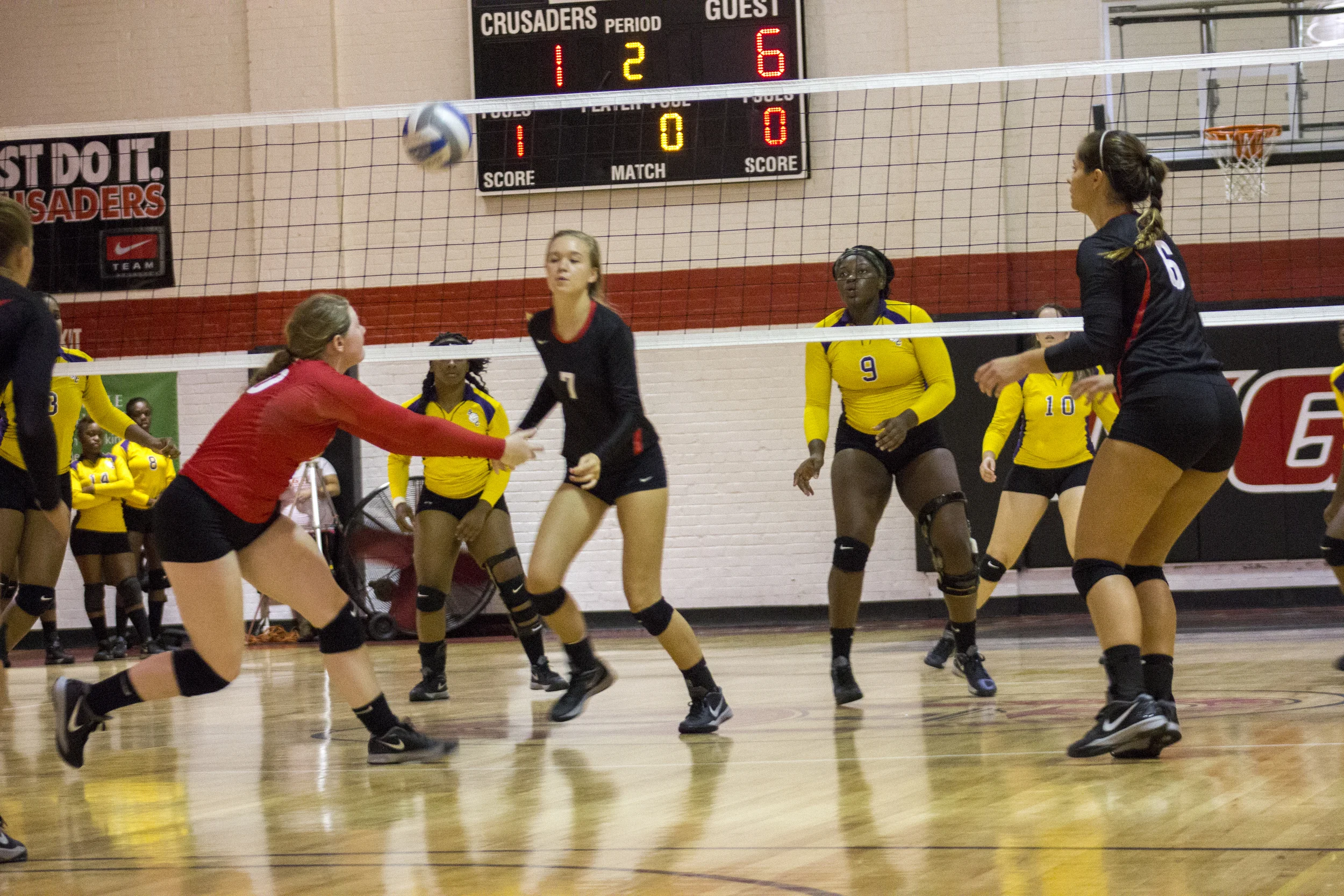 Junior Hannah Lewis bumps the ball to awaiting sophomore Haley Hester. 